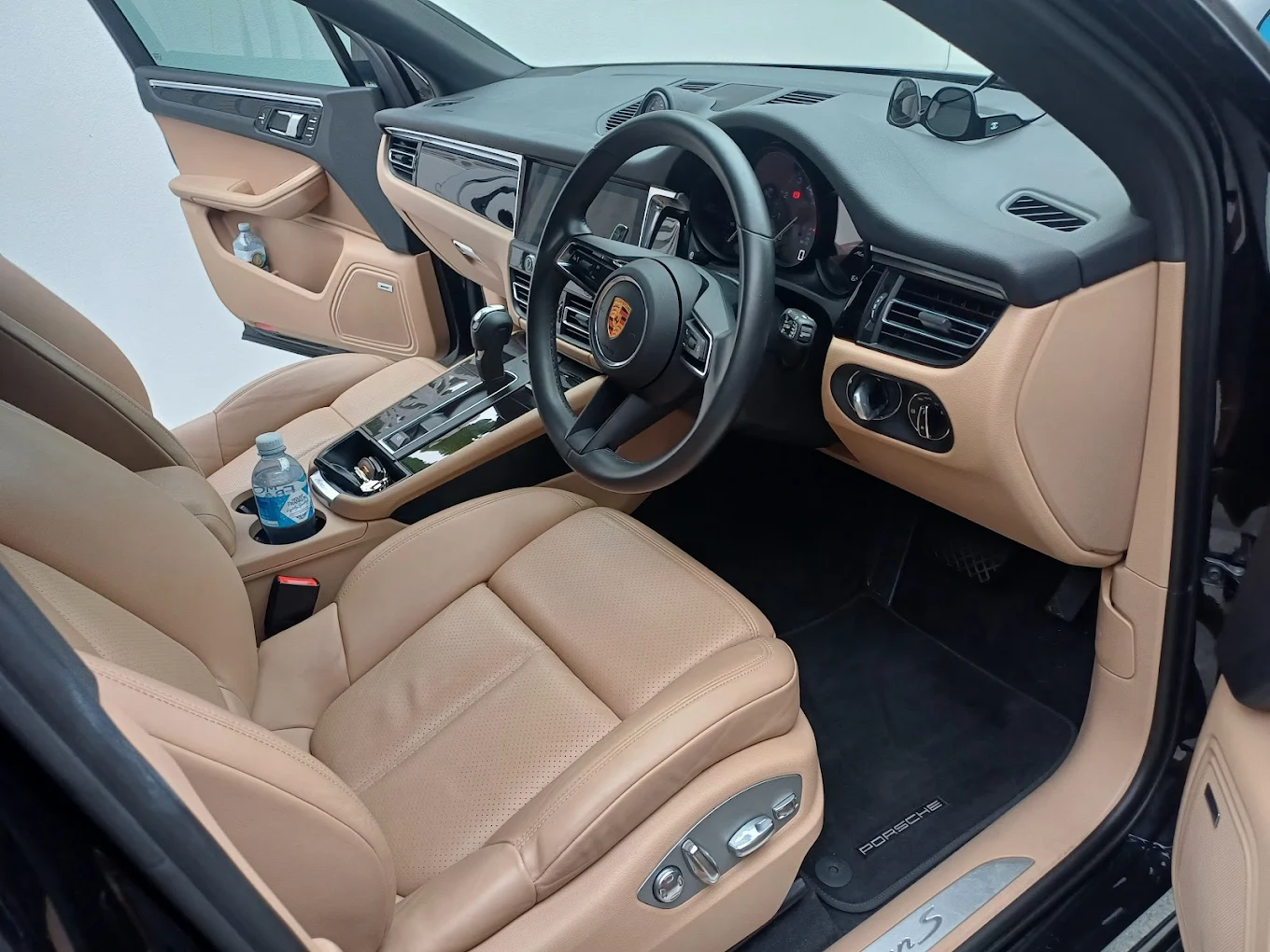 Porsche luxury interior detailing with tan leather